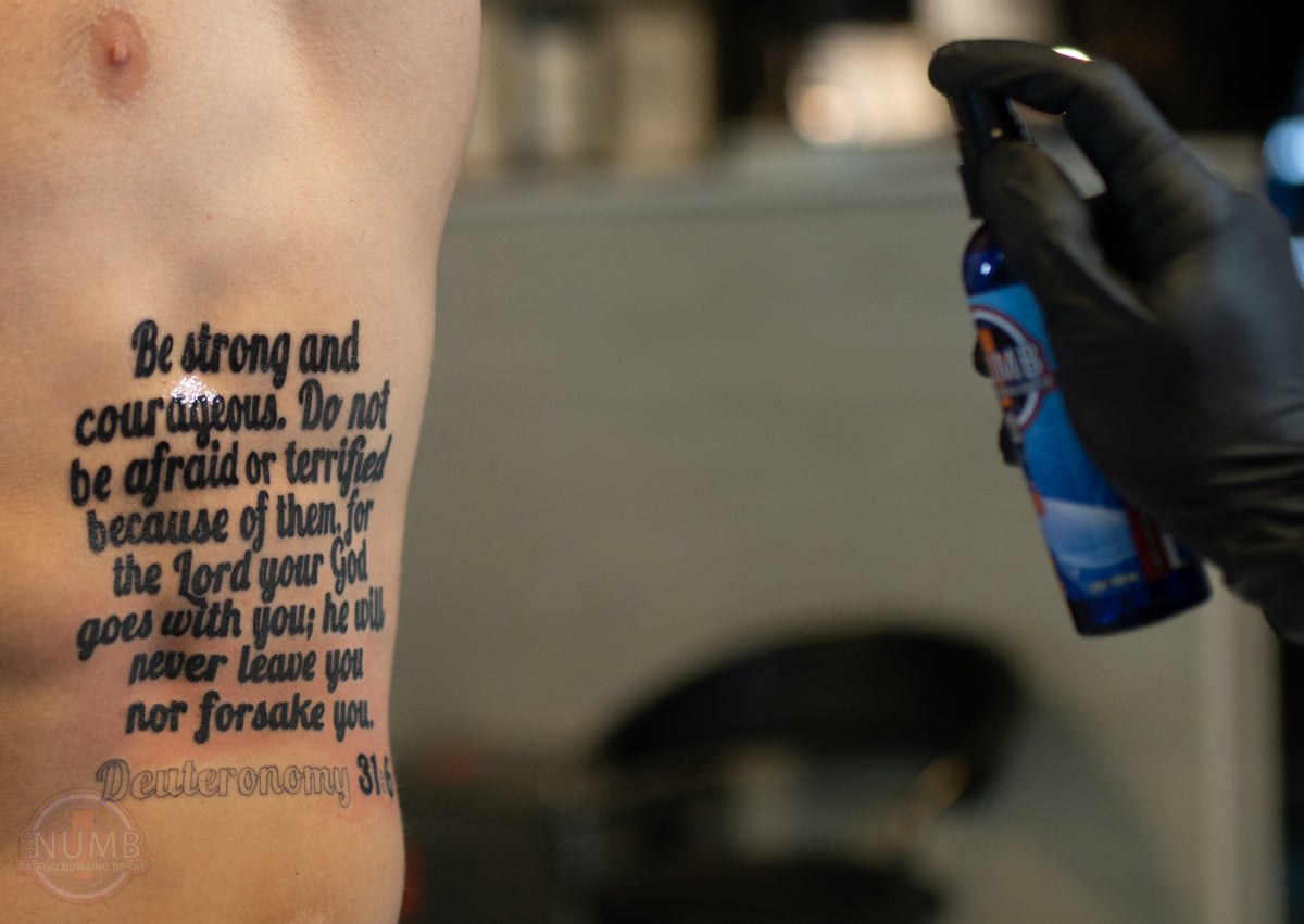 Tattoo artist working during a professional tattoo session